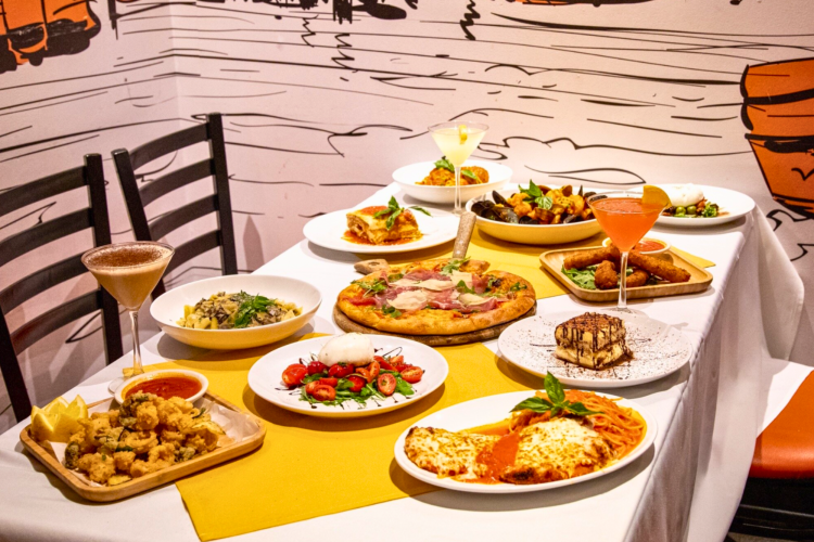 Zia Maria Little Italy restaurant in Manhattan table with pizza, cocktails and other Italian dishes