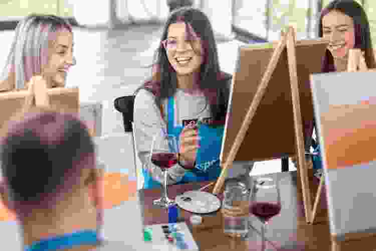 colleagues at a paint and sip party