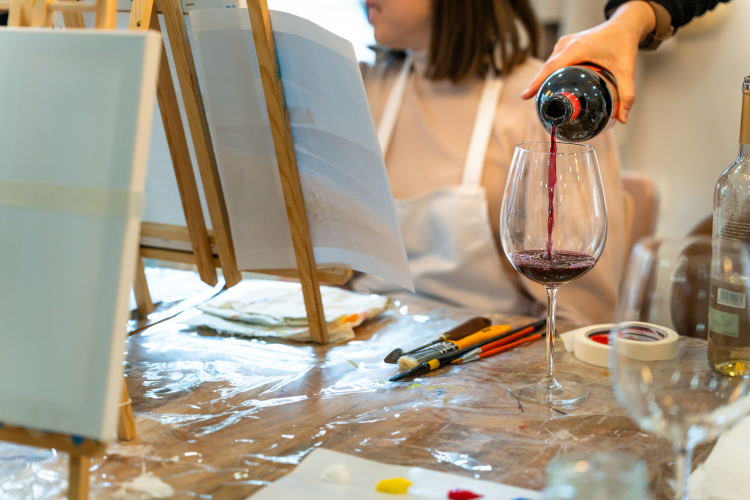 paint and sip party pouring wine