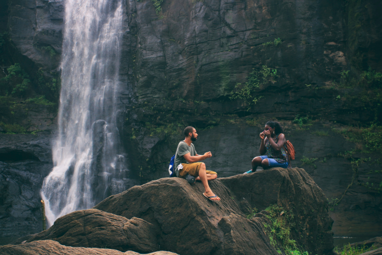 couple in front of waterfall 