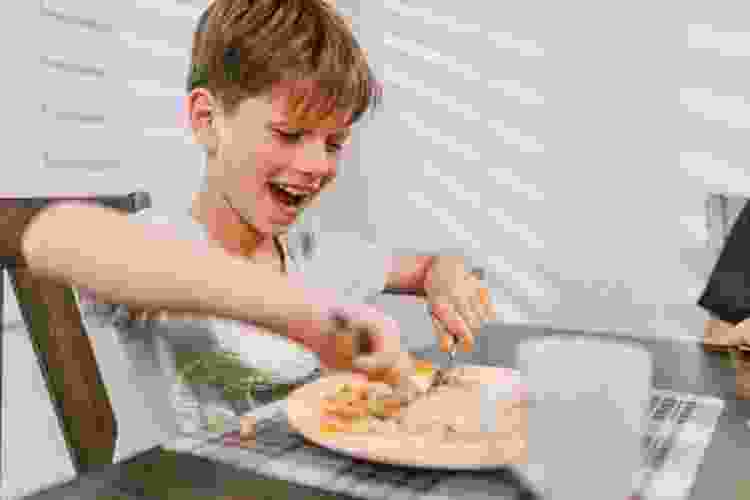 Boy eating breakfast