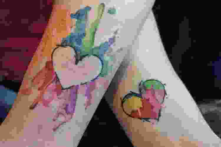 Matching water color heart tattoos