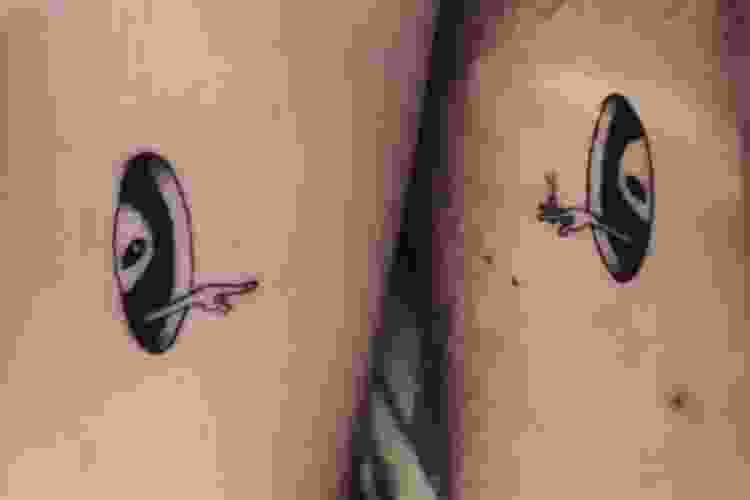 Matching alien tattoos
