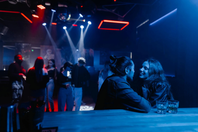 Diverse couple flirting in a club