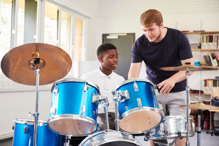 Middle school boy in Music Lessons
