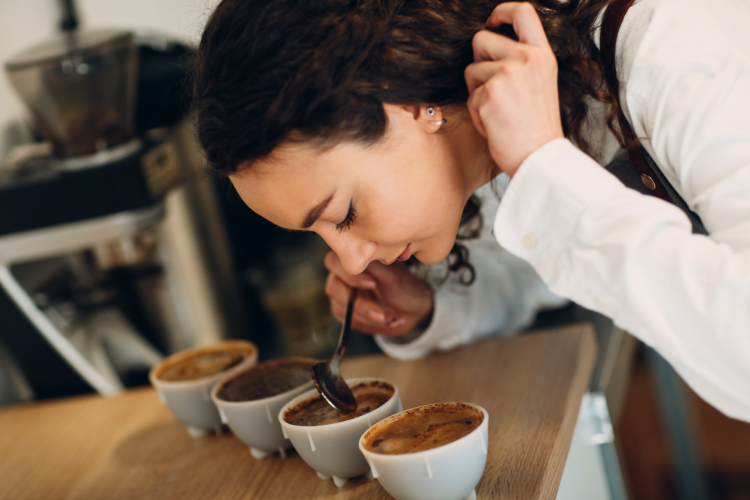 a woman coffee cupping