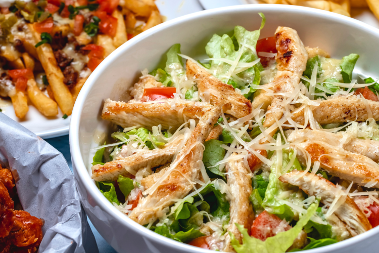 side view caesar salad grilled chicken fresh tomato lettuce parmesan cheese