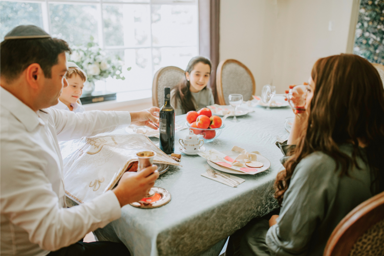 family sitting at the table asking what is rosh hashanah