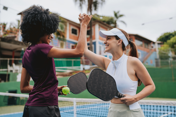 Women playing pickleball