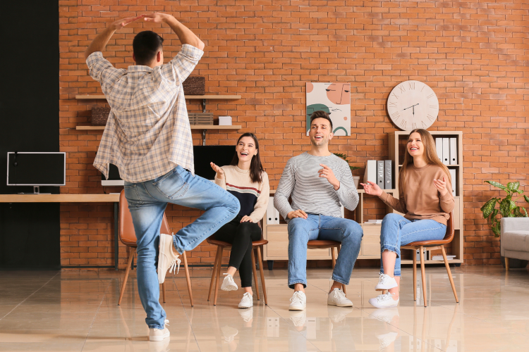 Man acting like a ballerina in a game of charades