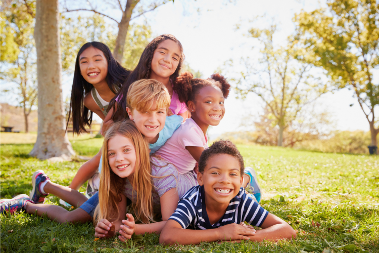 kids sitting together and smiling