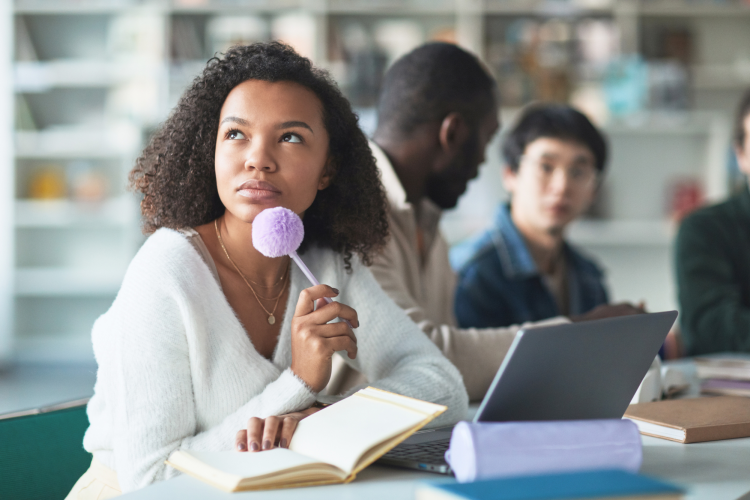 woman thinking critically in class