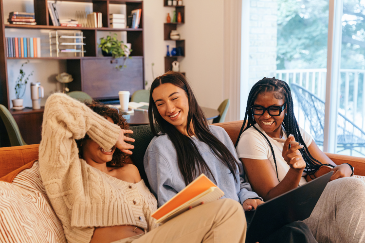 group of diverse women chatting and laughing inside
