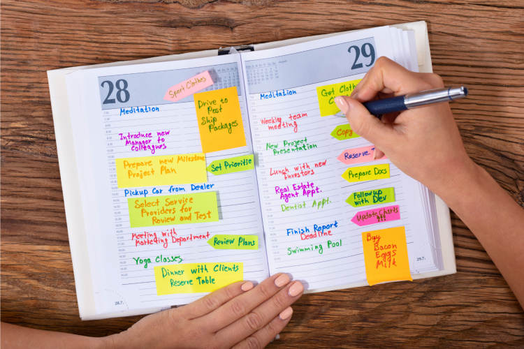 woman writing in a planner