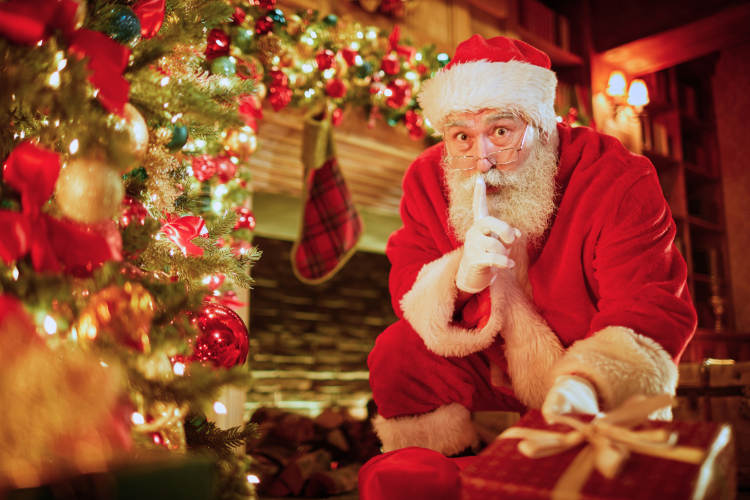 Santa with his finger to his mouth