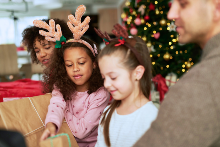 family giving secret santa gifts