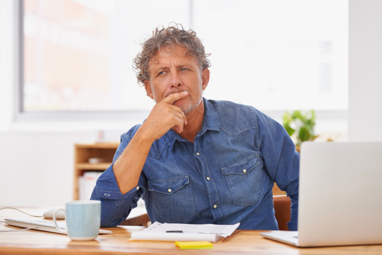 man thinking about something at work