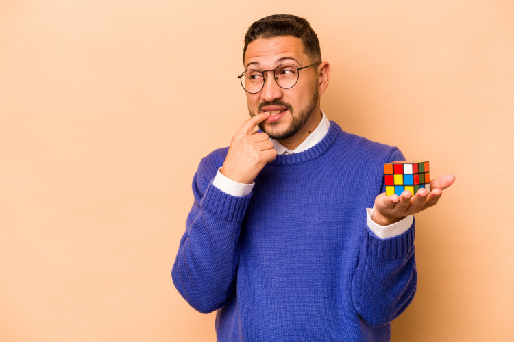 man holding a rubik's cube