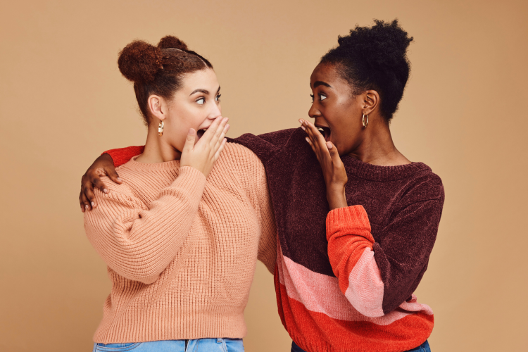 Two girls looking pleasantly shocked