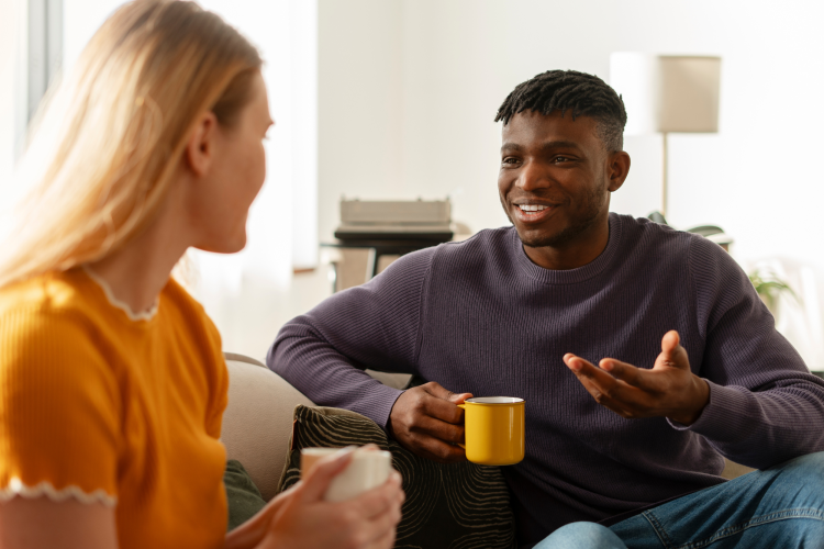 mixed couple talking over a coffee