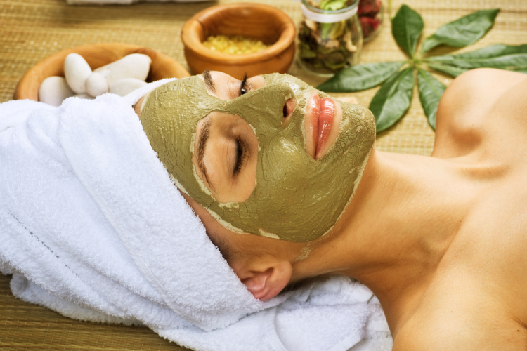 woman with a green tea mask