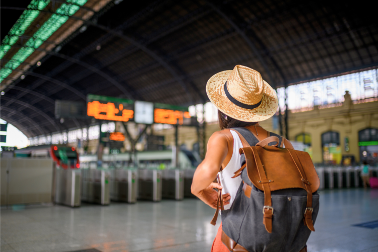 woman waiting alone at a train station