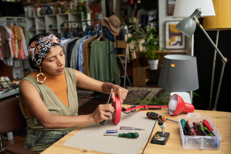 Woman Thrift Flipping Lamp