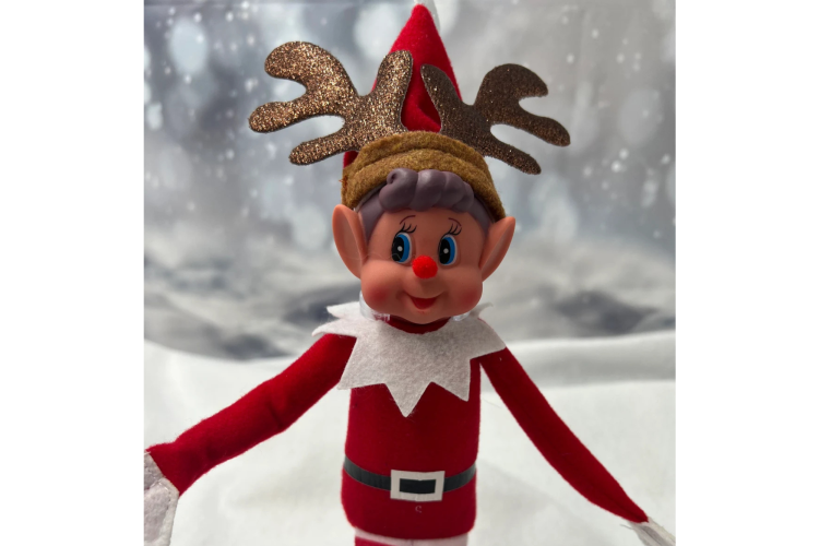 elf on the shelf with a Rudolph nose