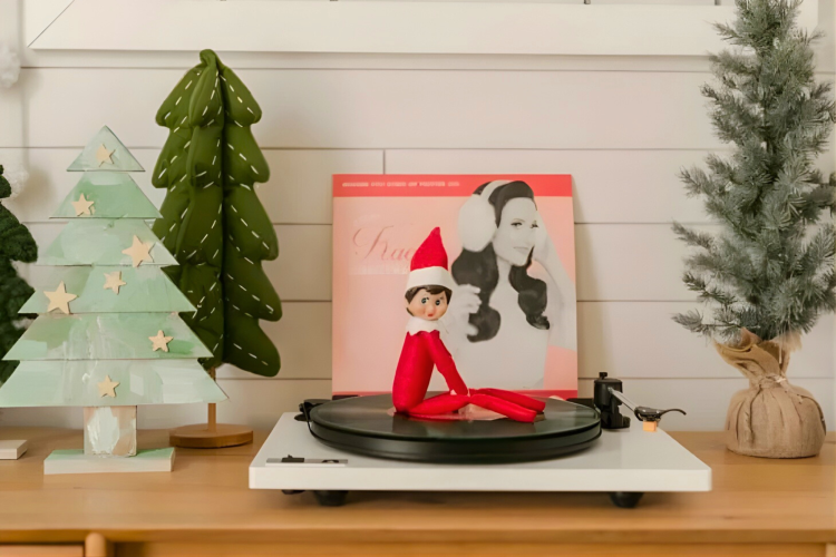 elf on the shelf on a record player