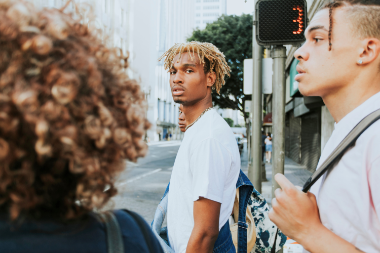 group people waiting cross road