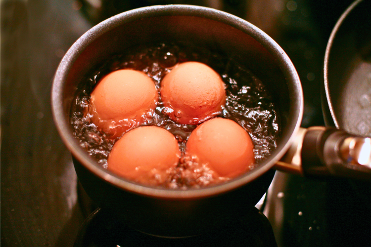 boiling eggs in a pan