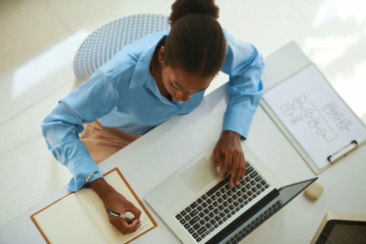 student writing in her textbook