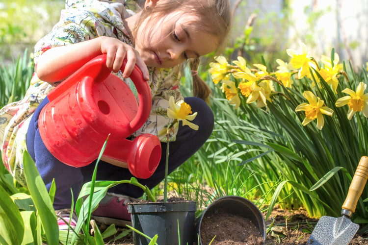 girl watering flowers