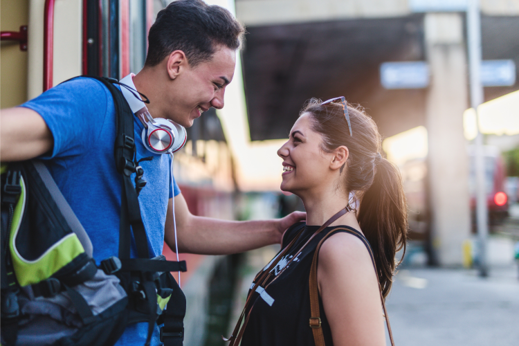 a couple meeting at a train station
