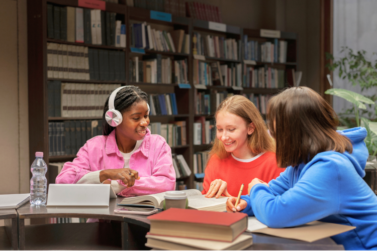 Middle School teens sitting the library