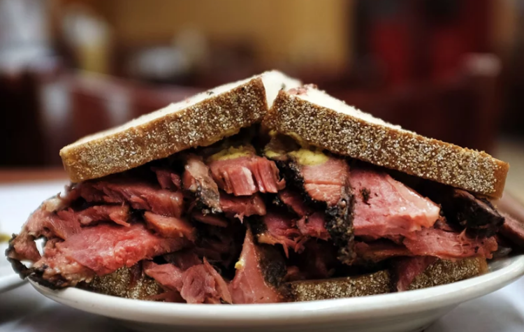 a heaping pastrami sandwich from Katz 's Delicatessen's Delicatessen