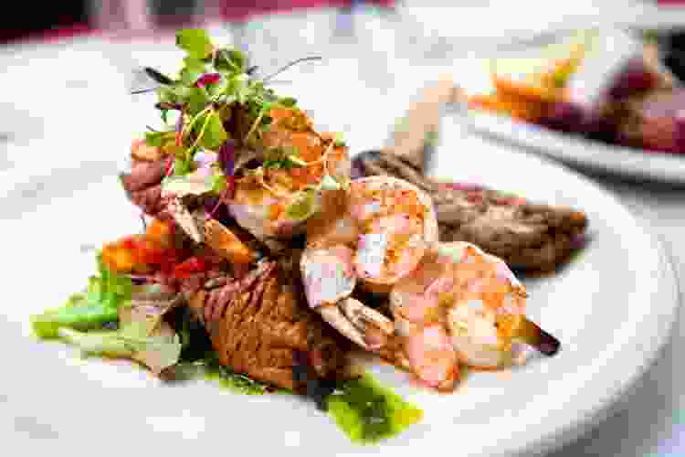 gourmet surf and turf course with shrimp and steak