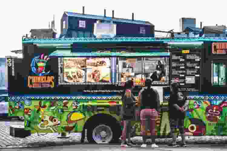 friends stopping for a bite at a food truck