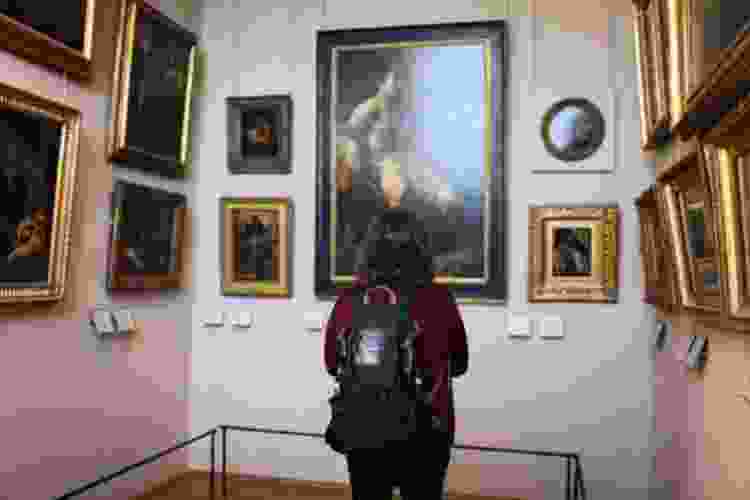 Woman admiring art in a museum