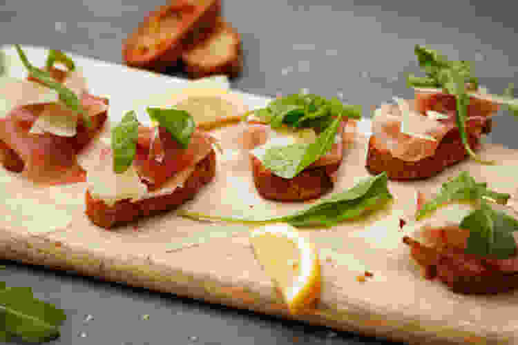 tapas bread with prosciutto and arugula  