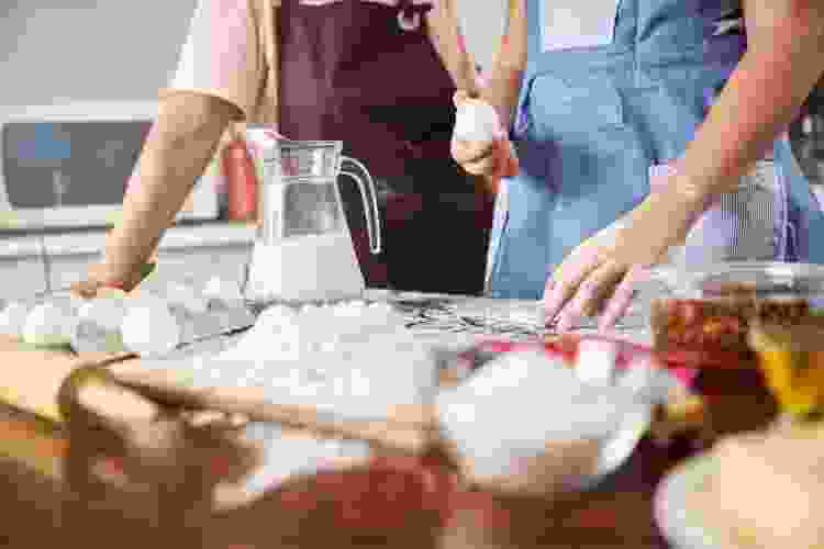 two people baking in the kitchen