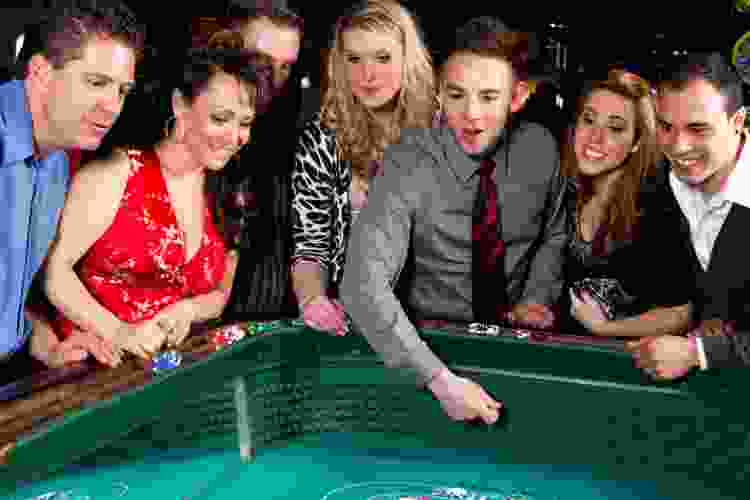 group of people gambling for Vegas-themed party