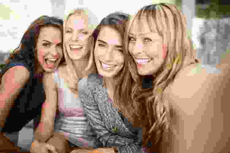 group of women laughing together 