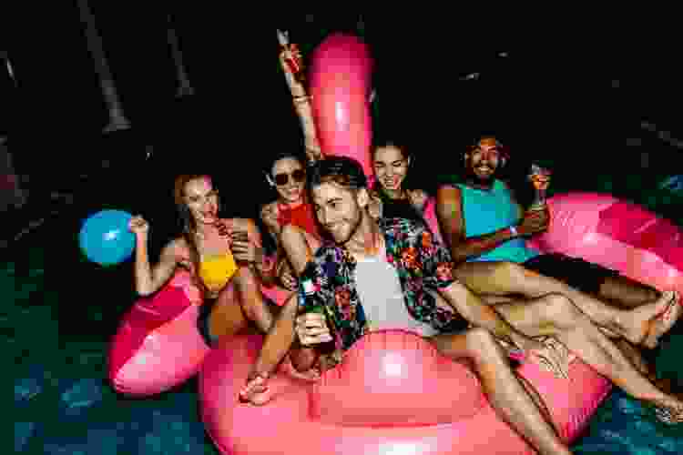 pool at night with flamingo inflatable