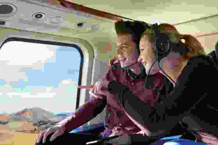 couple touring in helicopter 