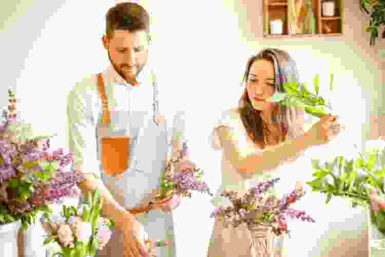 couple arranging flowers 