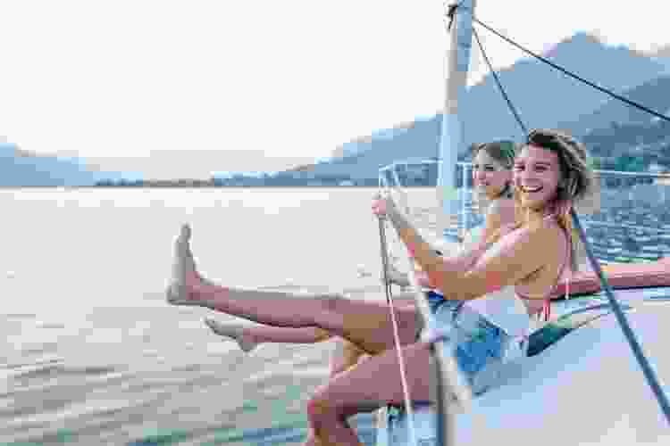 two women riding a sail boat