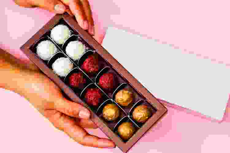 hand holding box of chocolates