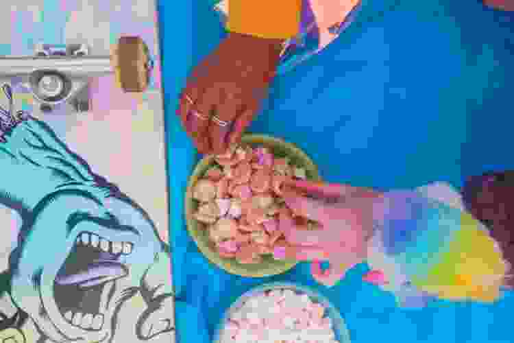 hands reaching for colorful 90s snacks