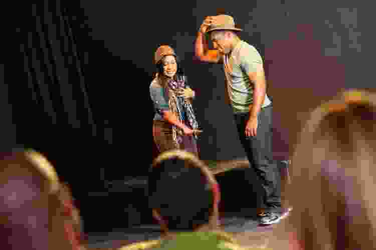 couple acting in class on stage